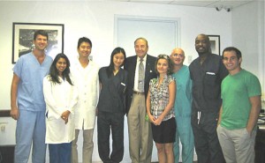 Dean D. Walter Cohen visits The Center for Special Dentistry.  Dr. Cohen (center) and Dr. Jeffrey Dorfman (wearing green scrubs) are surrounded by students.